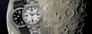 Alta Relojería, Lujo y Análisis 2 Relojes Berny opiniones: Dos modelos de titanio con cristal de zafiro sobre un fondo lunar, análisis técnico 2026.